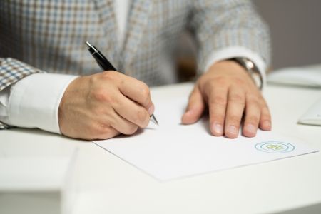 JP Service - Man Signing Document