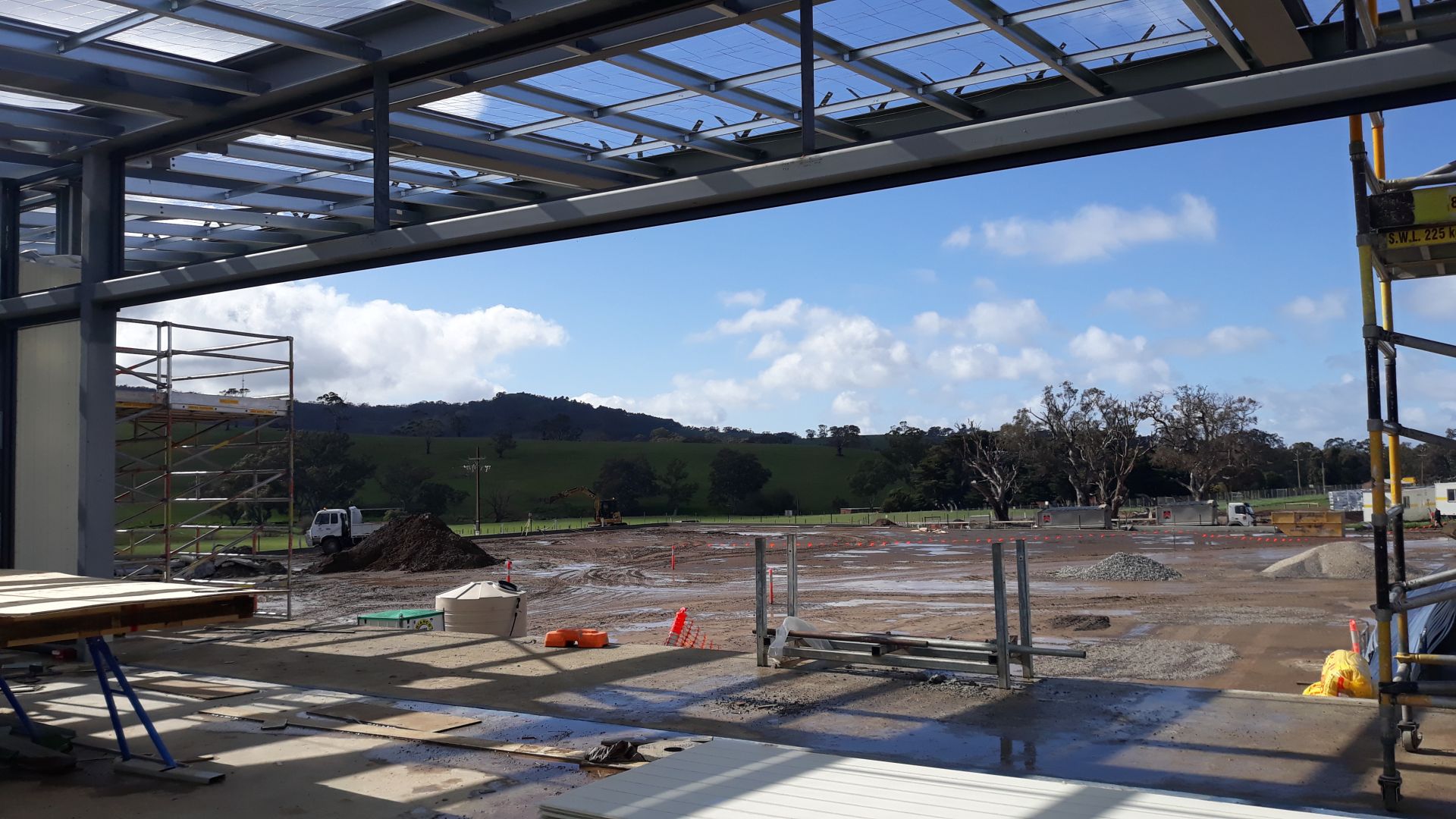 Building A Soccer overlooking pitch toward summit August 2020